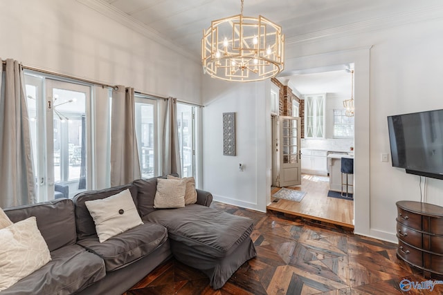 living room featuring crown molding, dark parquet floors, and a chandelier