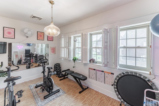 exercise area with light wood-type flooring