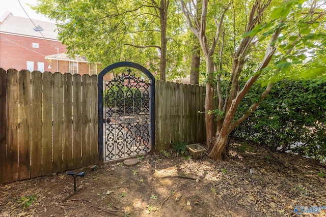 view of gate featuring fence