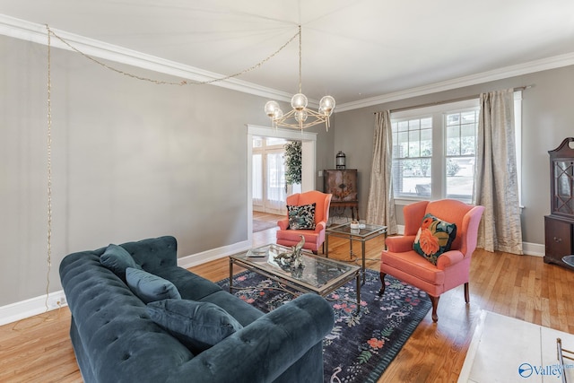 living room featuring crown molding, wood finished floors, and baseboards