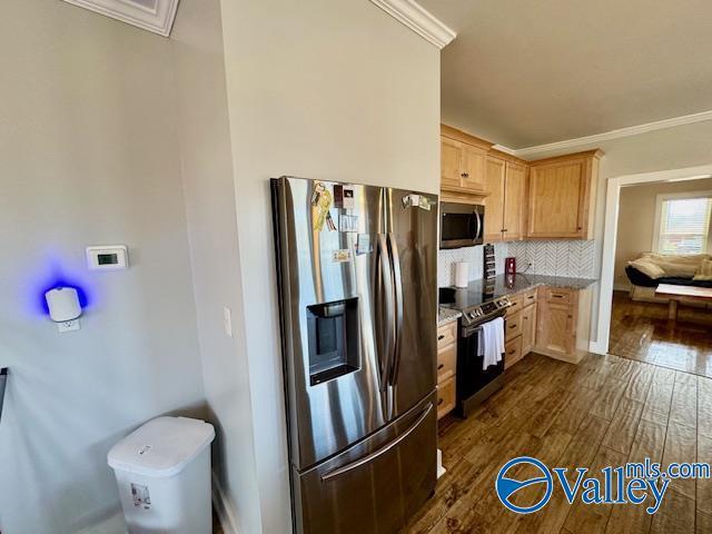 kitchen featuring dark hardwood / wood-style flooring, ornamental molding, stainless steel appliances, and light brown cabinets