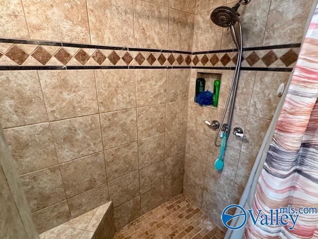 bathroom featuring a shower with curtain