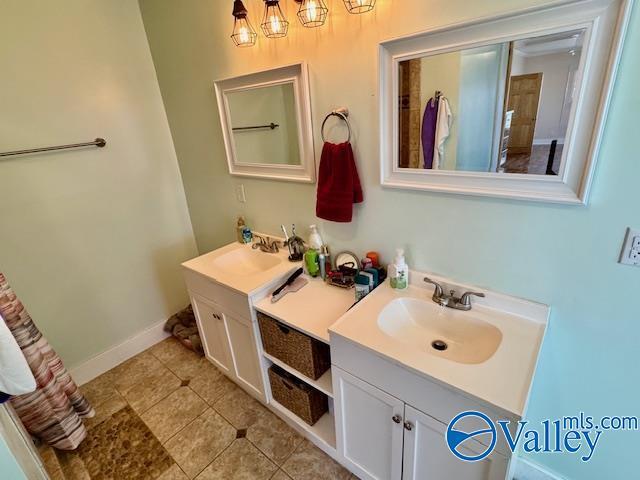 bathroom with vanity and tile patterned flooring