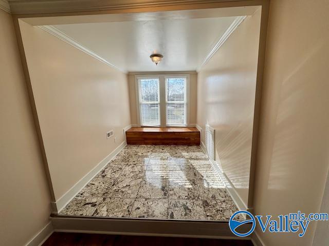 interior space with crown molding