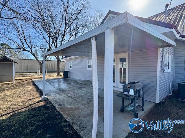 view of patio / terrace with a storage unit