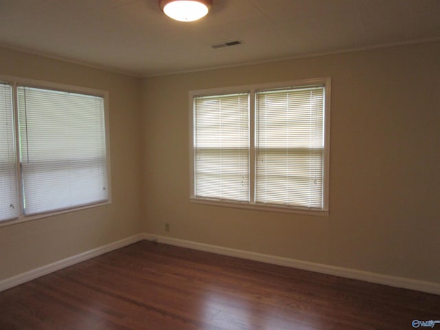 3201 Holmes Ave, Huntsville, AL 35816 - empty room with dark wood finished floors and crown molding