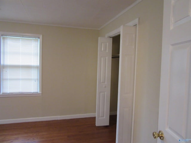 3201 Holmes Ave, Huntsville, AL 35816 - unfurnished bedroom with ornamental molding and dark wood finished floors