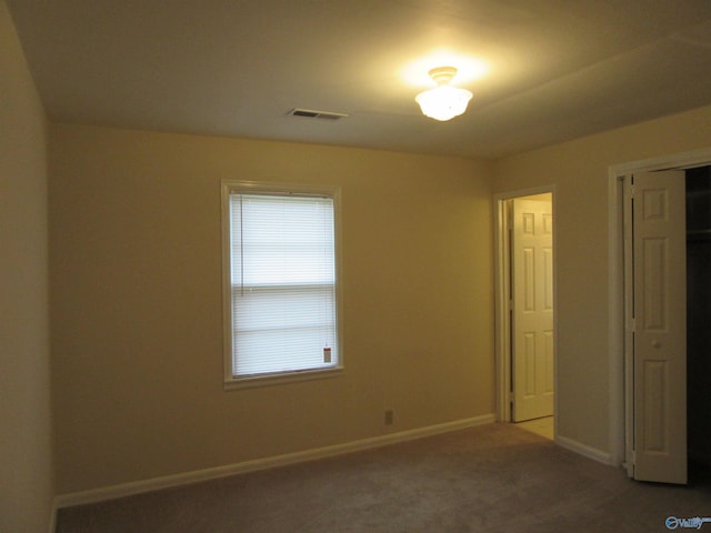 3201 Holmes Ave, Huntsville, AL 35816 - unfurnished bedroom featuring carpet floors and a closet