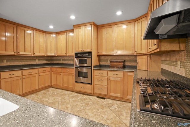 kitchen with ventilation hood, light tile patterned floors, gas cooktop, stainless steel double oven, and decorative backsplash