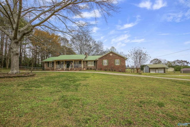 view of front of house with a garage, a front lawn, and a porch