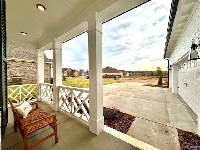 view of patio featuring a garage and covered porch