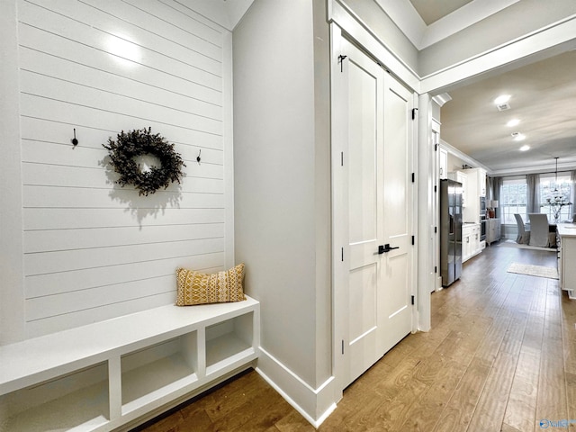 mudroom with light hardwood / wood-style flooring