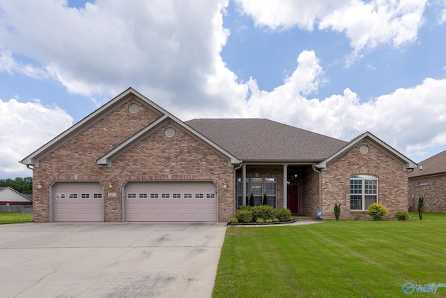2203 Sorrento Pl SW, Decatur, AL 35603 - single story home featuring driveway, a front lawn, brick siding, an attached garage, and a shingled roof