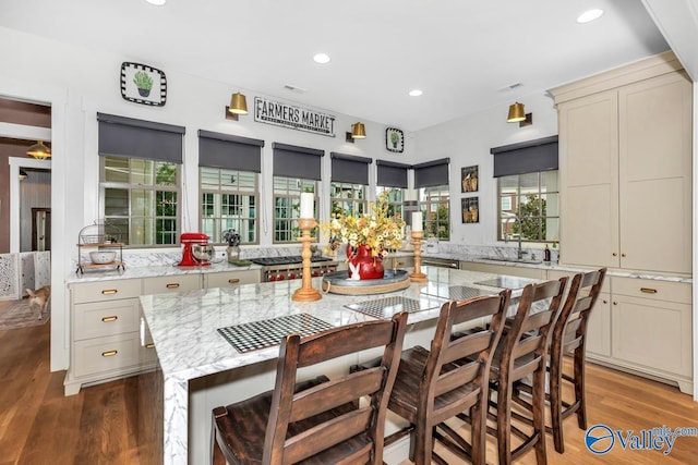 dining area with recessed lighting and light wood finished floors