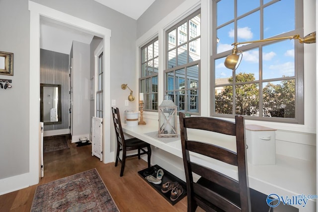 dining room with wood finished floors and baseboards