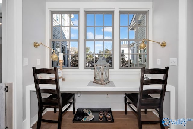 dining area with wood finished floors