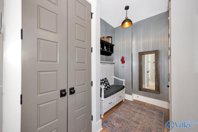 mudroom with baseboards and wood finished floors