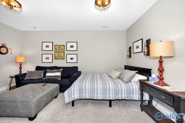 bedroom featuring visible vents, baseboards, and carpet floors