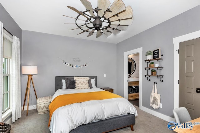 bedroom featuring baseboards, a ceiling fan, ensuite bathroom, and carpet flooring