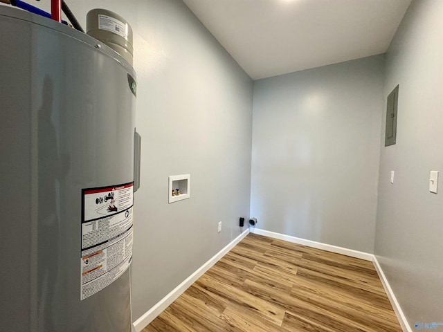 washroom featuring hardwood / wood-style floors, electric dryer hookup, electric water heater, electric panel, and hookup for a washing machine