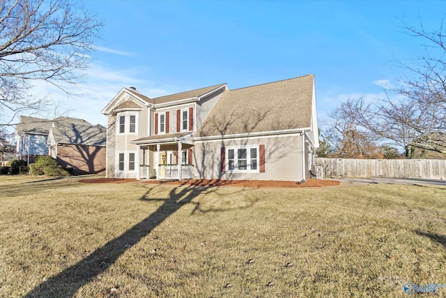 back of house with a lawn