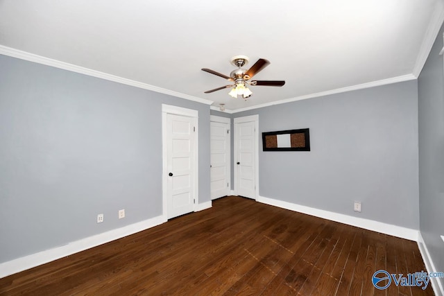 unfurnished bedroom with ornamental molding, wood finished floors, and baseboards