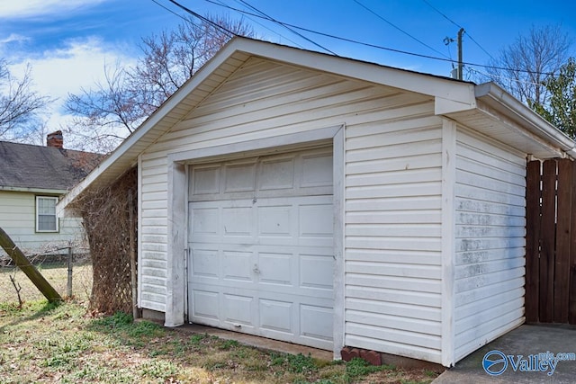 detached garage with fence