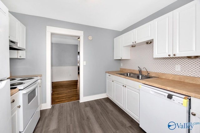 kitchen featuring white appliances, a sink, white cabinetry, and under cabinet range hood