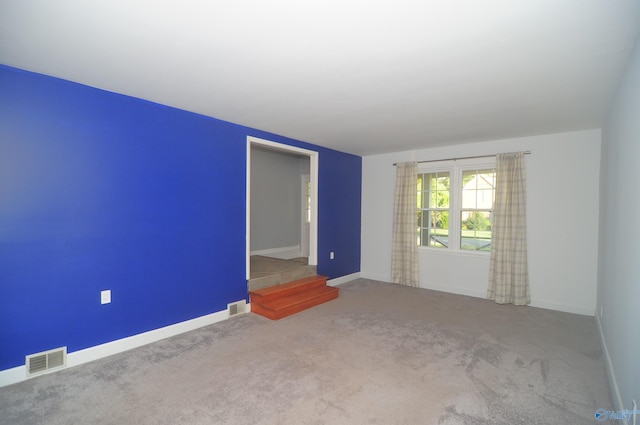 empty room featuring carpet flooring