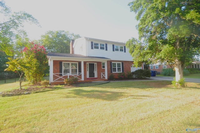 view of front of property with a porch and a front lawn