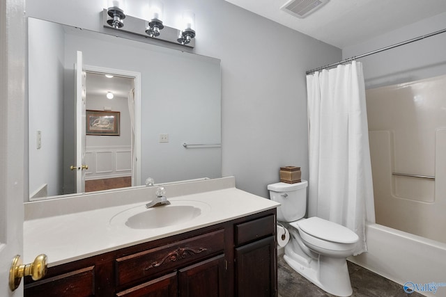 full bathroom with shower / bath combo with shower curtain, toilet, and vanity