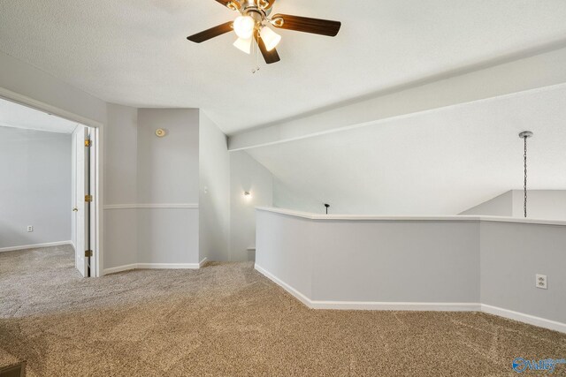 interior space with vaulted ceiling and ceiling fan