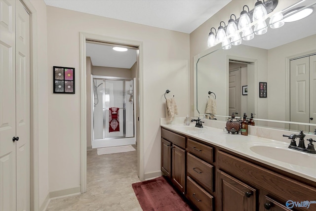 12100 Two Rivers Dr Phi, Phi, Athens, AL 35611 - bathroom with double vanity, a shower stall, and a closet