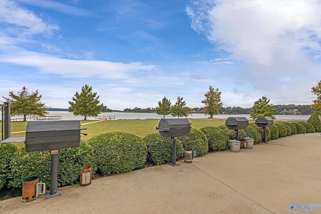 12100 Two Rivers Dr Phi, Phi, Athens, AL 35611 - view of green lawn with a water view and a patio
