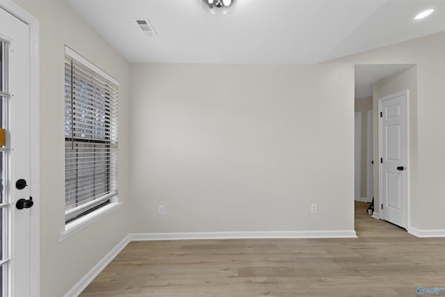 spare room with light wood-type flooring