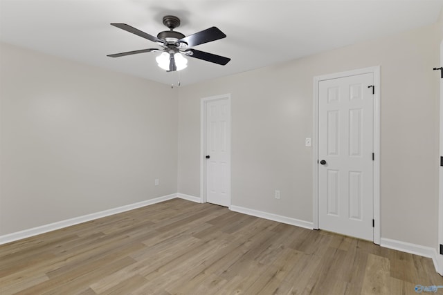 unfurnished room featuring ceiling fan and light hardwood / wood-style floors