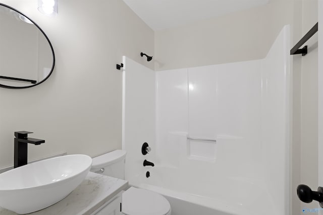 full bathroom with vanity, bathing tub / shower combination, and toilet