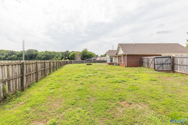 view of yard with a fenced backyard