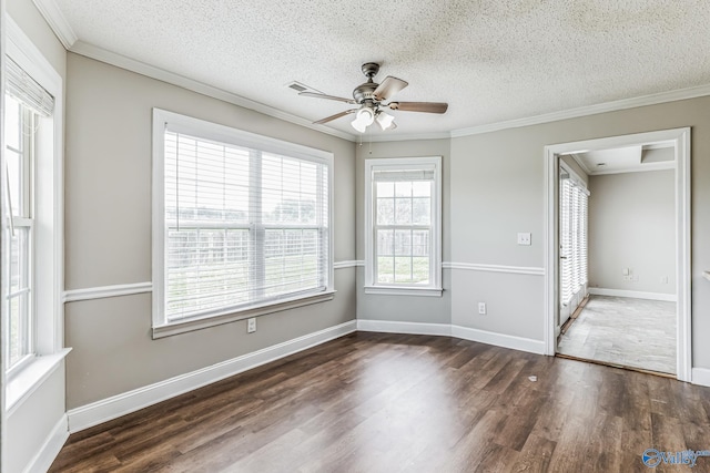 unfurnished room with a textured ceiling, dark hardwood / wood-style flooring, ornamental molding, and ceiling fan