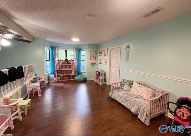 1055 Georgia Mountain Rd, Guntersville, AL 35976 - bedroom featuring wood finished floors, a textured ceiling, and baseboards