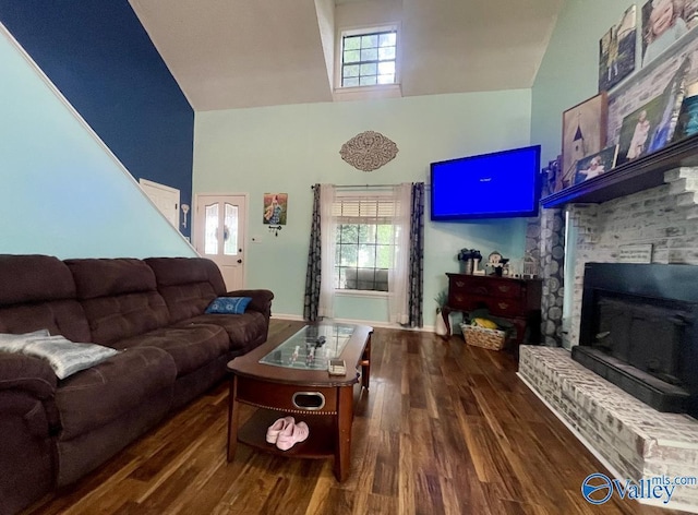 1055 Georgia Mountain Rd, Guntersville, AL 35976 - living room with high vaulted ceiling, wood finished floors, and baseboards