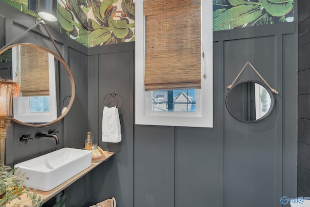 bathroom with sink and a wealth of natural light