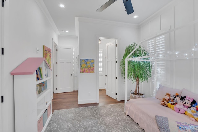 bedroom featuring crown molding and hardwood / wood-style floors