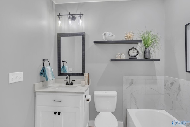 bathroom with vanity, toilet, and a bathing tub