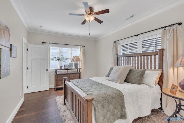 bedroom featuring ornamental molding, dark hardwood / wood-style floors, and ceiling fan