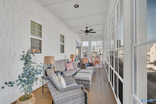 sunroom / solarium with ceiling fan