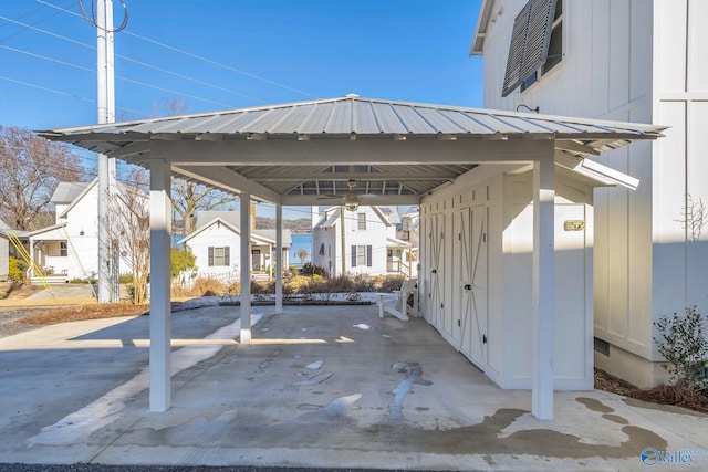 view of parking / parking lot with a carport