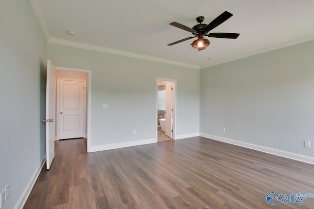 interior space with ceiling fan, dark hardwood / wood-style flooring, and crown molding