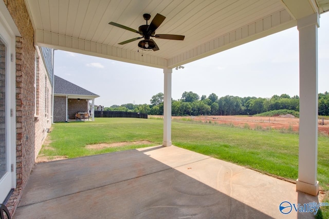 view of patio / terrace featuring ceiling fan and a rural view