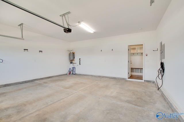 garage with electric panel and a garage door opener